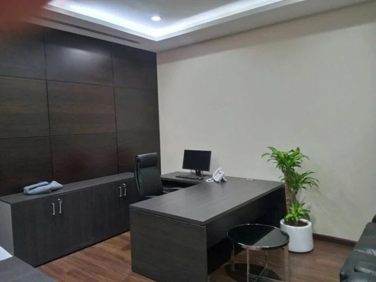 Private office desk and timber feature wall